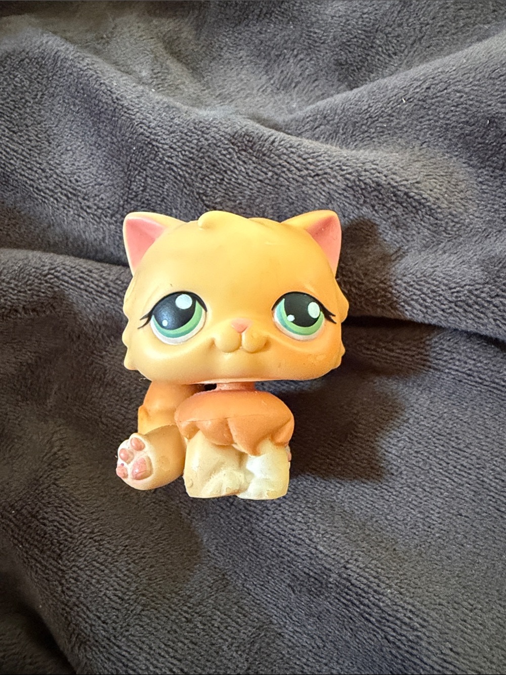 orange and yellow Littlest Pet Shop Persian Cat #217 figurine from 2007